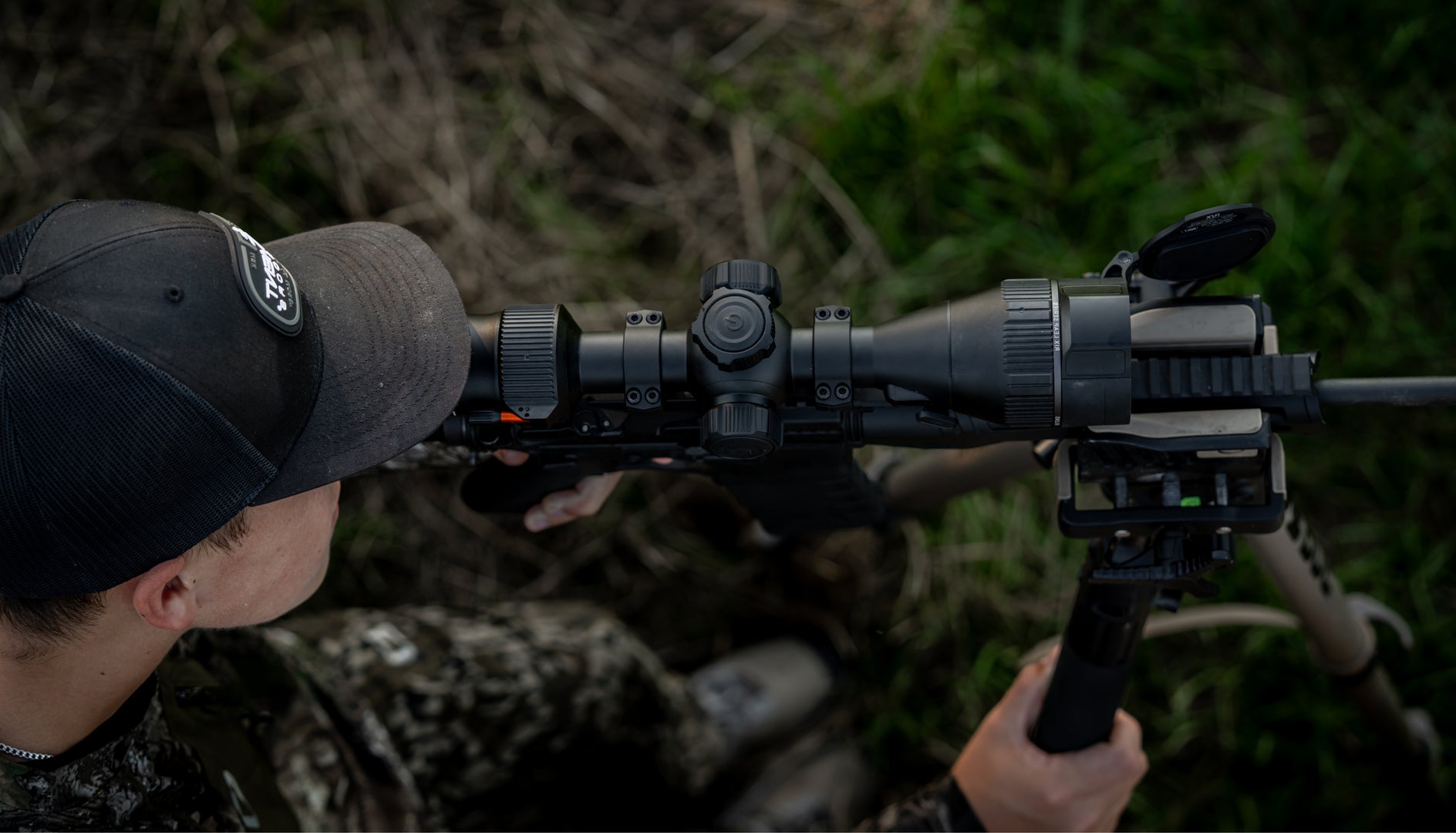 HUNTER LOOKING THROUGH THERMAL SCOPE